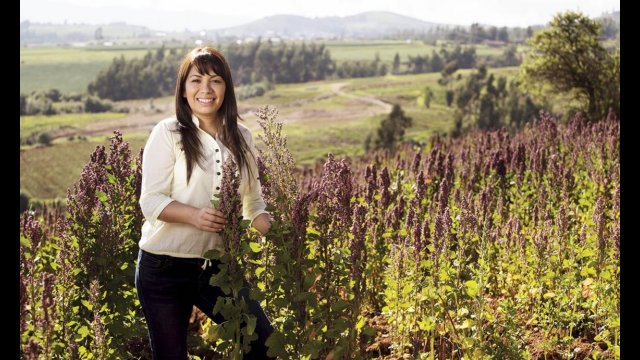 Young woman standing in a field of plants