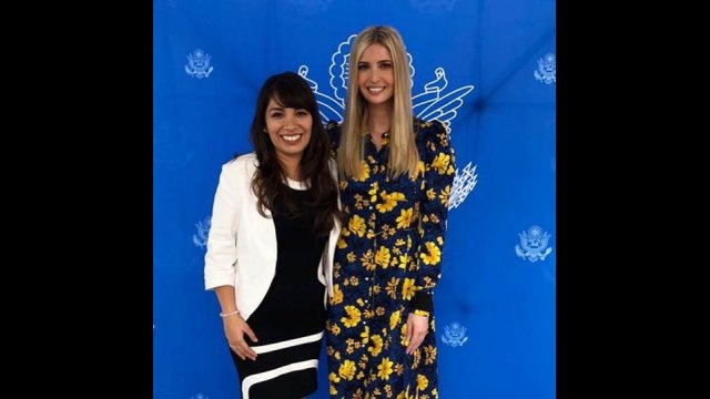 Young woman standing next to tall woman with long blonde hair