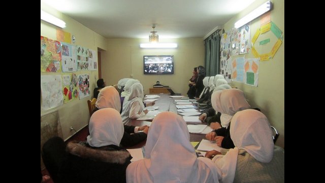 Afghan students engage with their US peers during a videoconference, part of a yearlong virtual exchange program with Global Nomads Group.