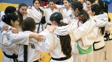 Girls huddle together
