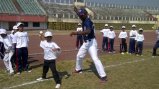 Joe Logan assists team members with their fast pitch. Joe Logan assists team members with their fast pitch.