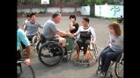 Participants from Mobility International USA and Guangzhou English Training Center (GETCH) students work together on the court.