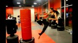 A Tajik coach practices her kick in one of the many training sessions.