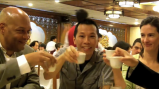 "Citizen Diplomats" from the National Council for International Visitors raise their tea cups in a gesture meant to welcome visitors from around the world.