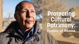 Native man looking past the camera with the words "Protecting Cultural Patrimony" superimposed to the right of his face. 