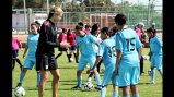 Marian Dalmy shares tips on soccer techniques with young players in Morocco.