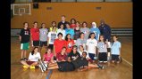 The Envoys pose with a group of young Jordanian female players after a basketball clinic.