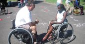 YES student Stella Tiyoy from Kenya meets with a physical therapist and wheelchair user to discuss opportunities to participate in wheelchair sports in the United States.