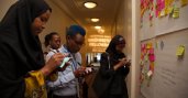Mandela Washington Fellows brainstorming at the feedback wall.