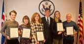 Group photo of participants holding certificates