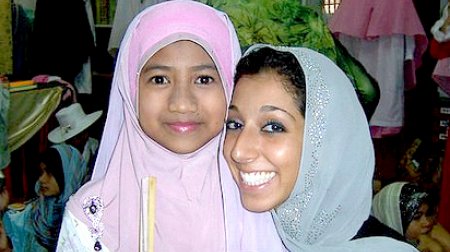 Lynn ElHarake, Fulbright English Teaching Assistants (ETA) to Malaysia, February 2011, with a student at The Muslim Girls' Fashion Club charity show in Terengganu.